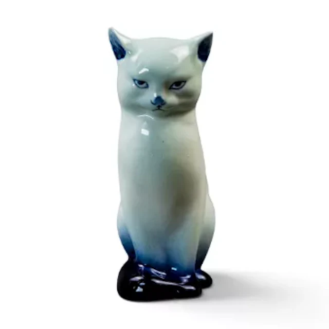 A Royal Doulton rare pre flambe model of a seated cat, model number