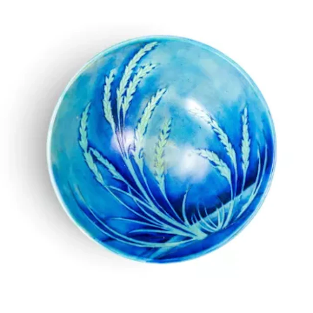 A Moorcroft salt glazed bowl in the Waving Corn design on a blue ground