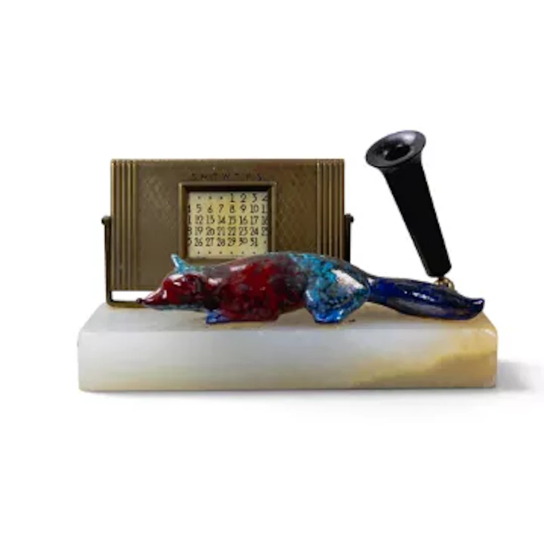 A Royal Doulton Sung lying fox, c1920's, in typical colours, mounted