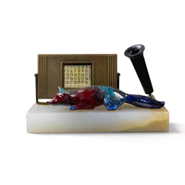A Royal Doulton Sung lying fox, c1920's, in typical colours, mounted