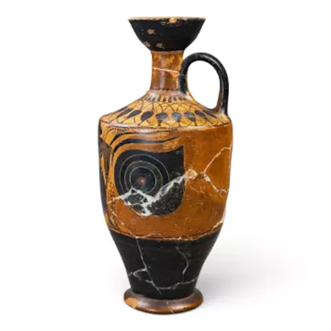 An early terracotta handled vessel, Greek in style, decorated with