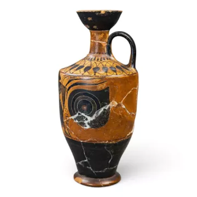 An early terracotta handled vessel, Greek in style, decorated with