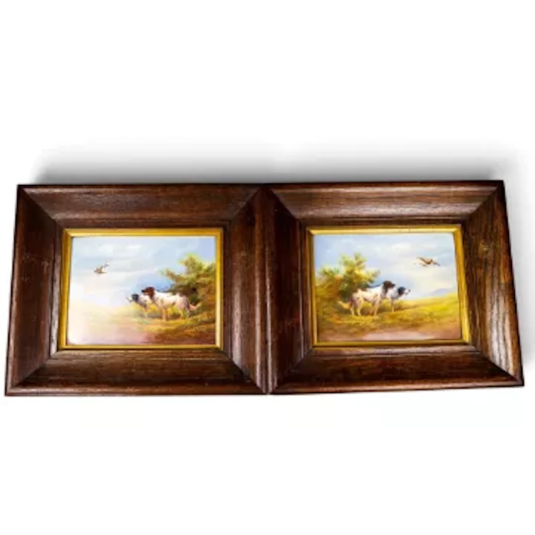 Two framed Crown Devon Fieldings plaques each featuring 2 gundogs
