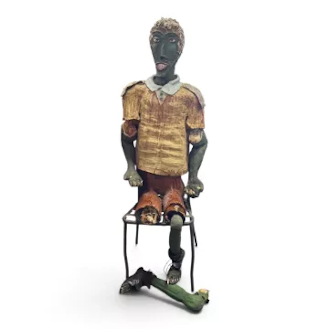 Plaster and ceramic folk art figurative sculpture of a distressed