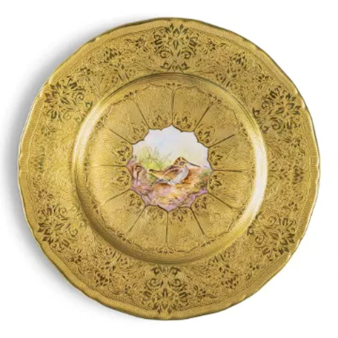 A Royal Worcester plate decorated with hand painted woodcock to centre