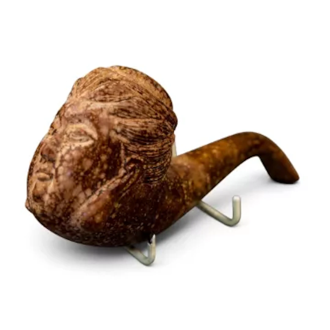 Hand carved briar wood figural tobacco pipe with a persons face carved