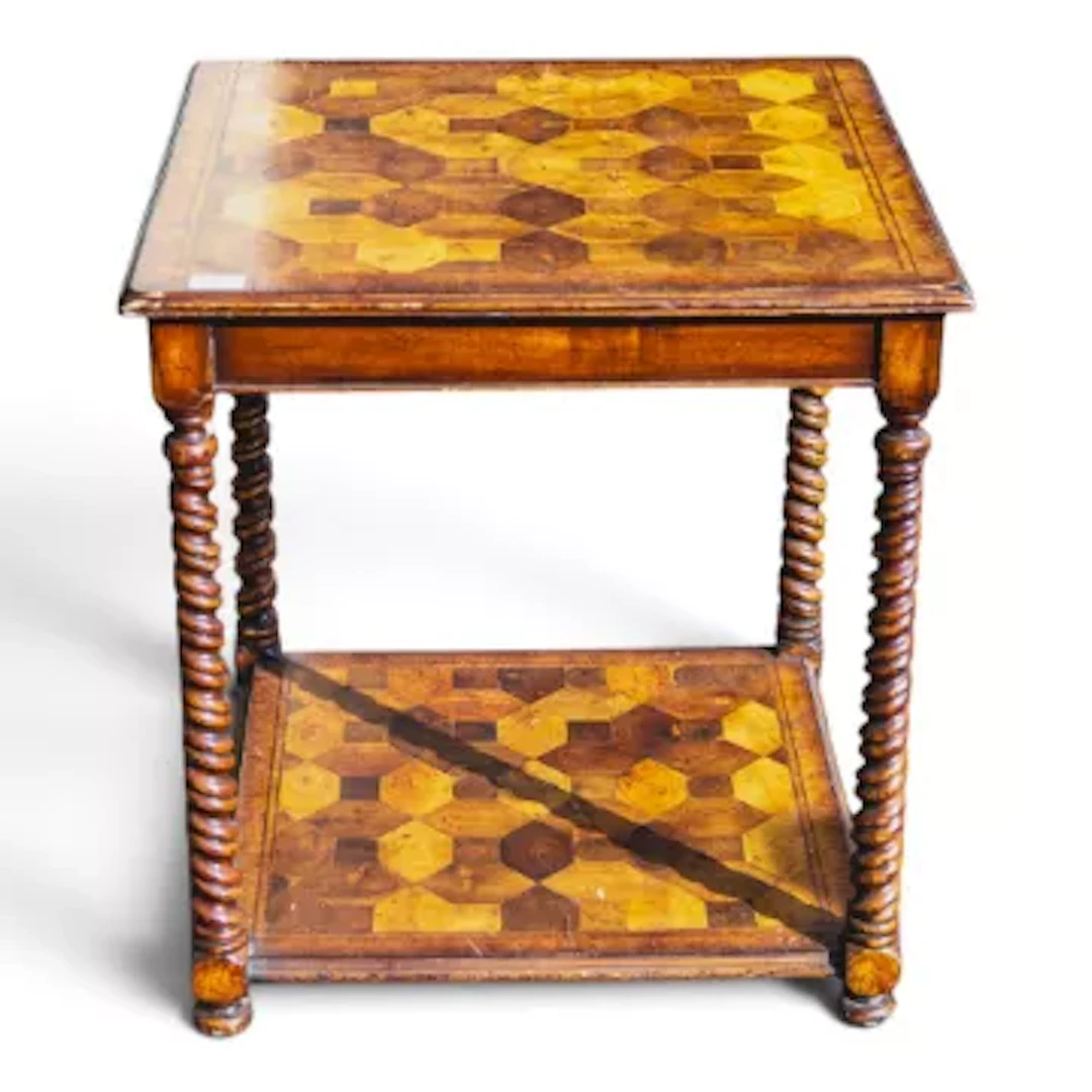 A vintage two-tier square table, featuring geometric patterns & turned