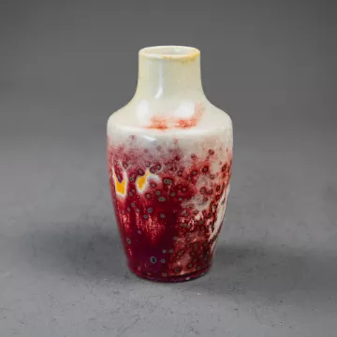 A Ruskin high fired vase with stand, with a mottled Flambe glaze with