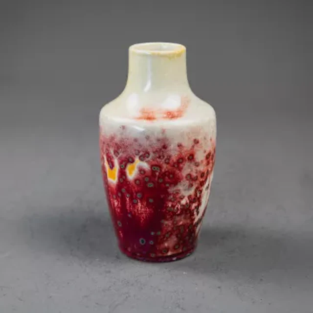 A Ruskin high fired vase with stand, with a mottled Flambe glaze with