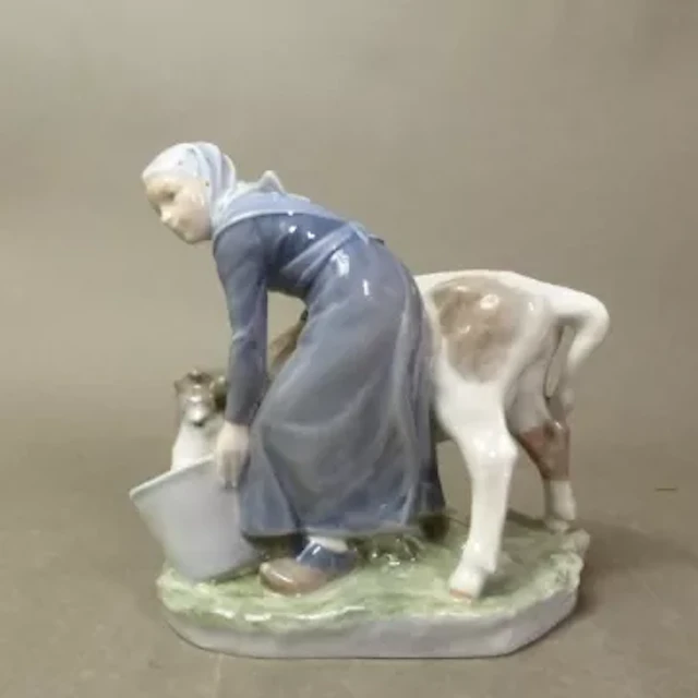 Royal Copenhagen figure Girl With Calf, designed by Christian Thomsen