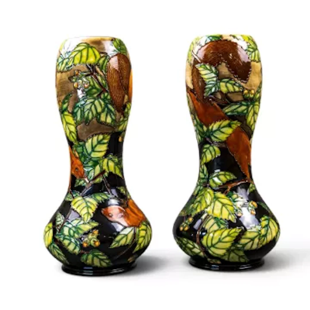 A pair of Moorcroft limited edition squirrel design vases, designed