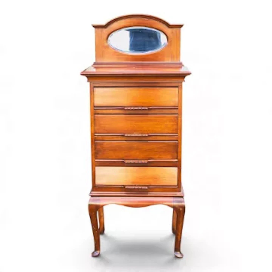 An Edwardian mahogany four drawer music cabinet featuring a small