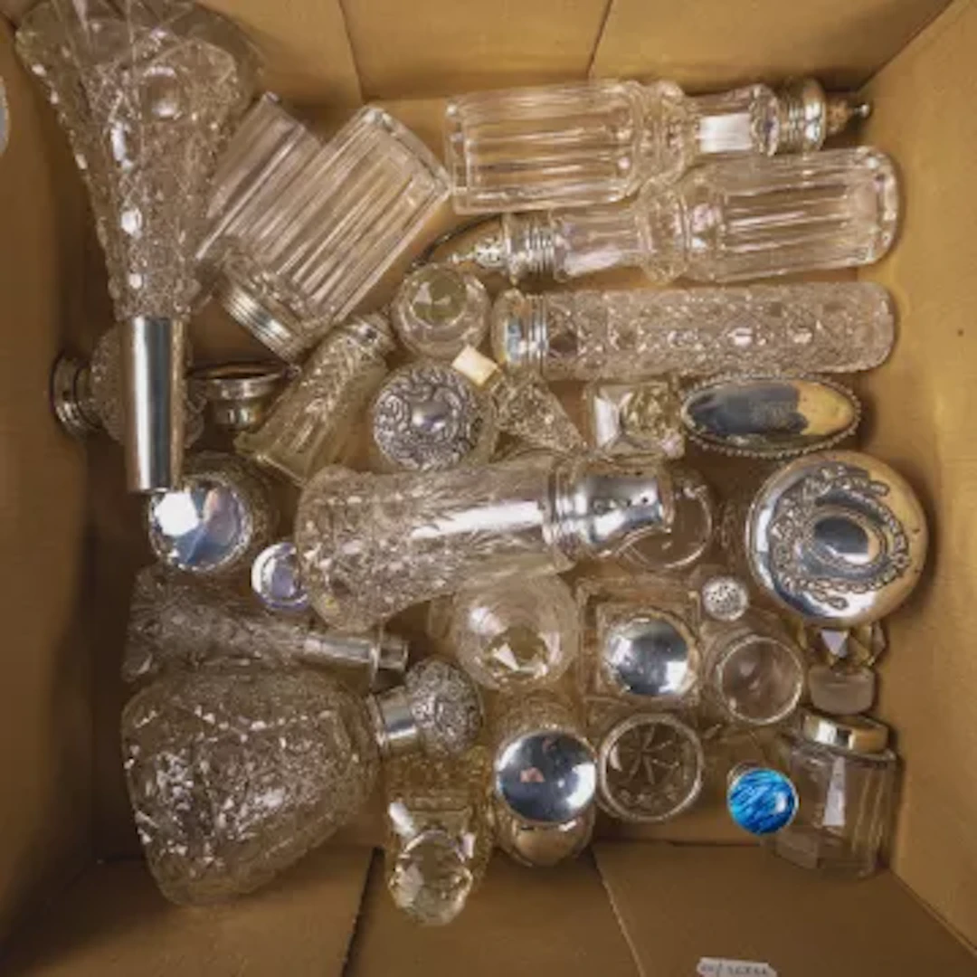A good collection of 30 silver and glass items including bottles