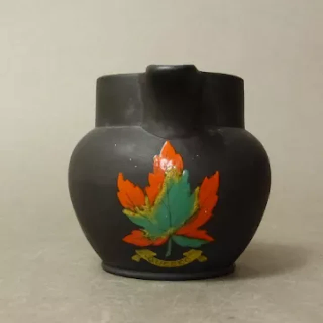 Wedgwood Kenlock Ware black basalt jug, polychrome enamel crest, Quebec
