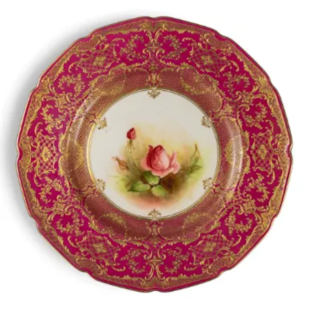 A Royal Doulton plate ornately decorated, featuring Rose design to