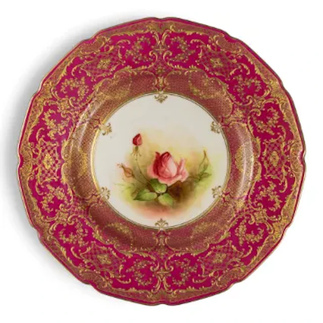 A Royal Doulton plate ornately decorated, featuring Rose design to