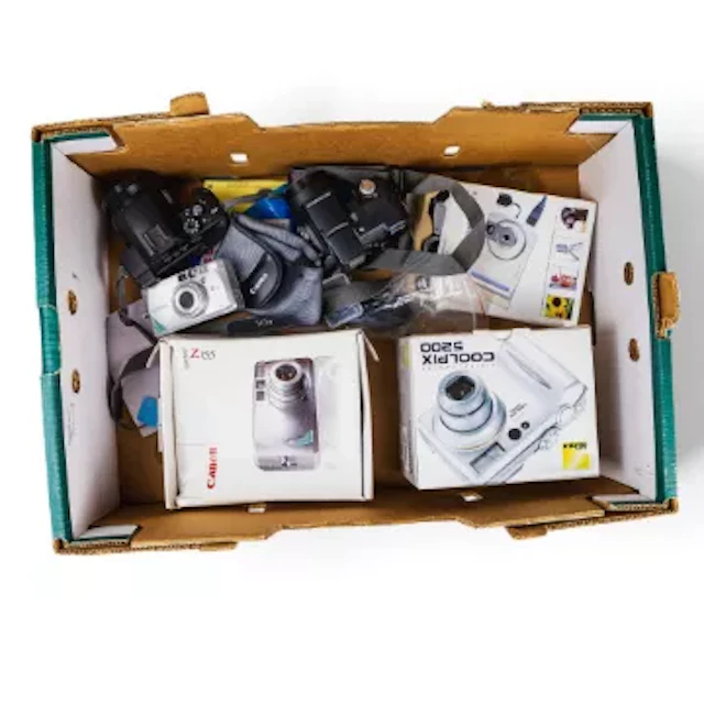 A collection of digital cameras to include Nikon Coolpix 5200, Canon