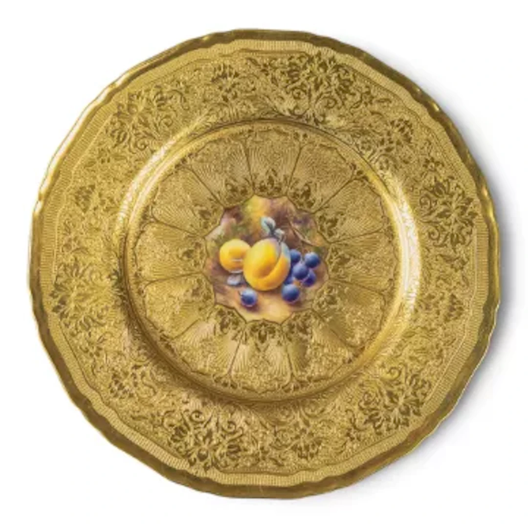 A Royal Worcester plate decorated with hand painted fruits to central