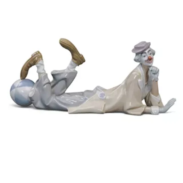 A Lladro figure of a large clown with a beach ball, model no.4618