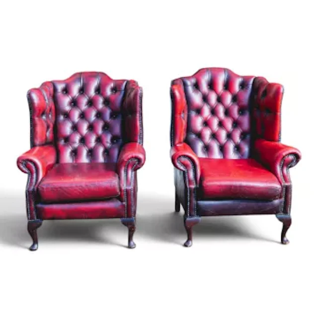 Pair of Chesterfield red leather high back winged armchairs on queen