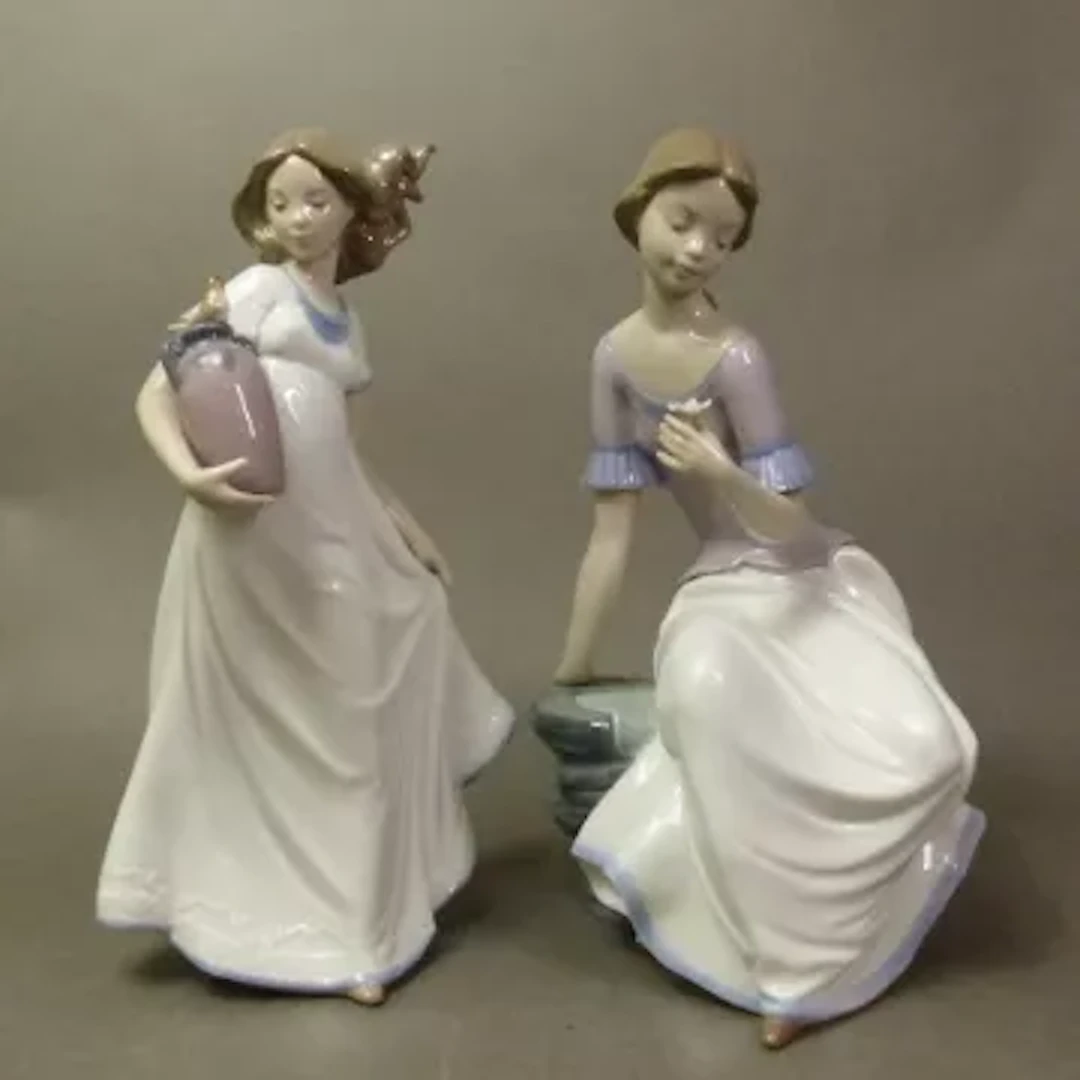 Two Nao figurines, models 1392 and 1409, tallest 29cm (2).