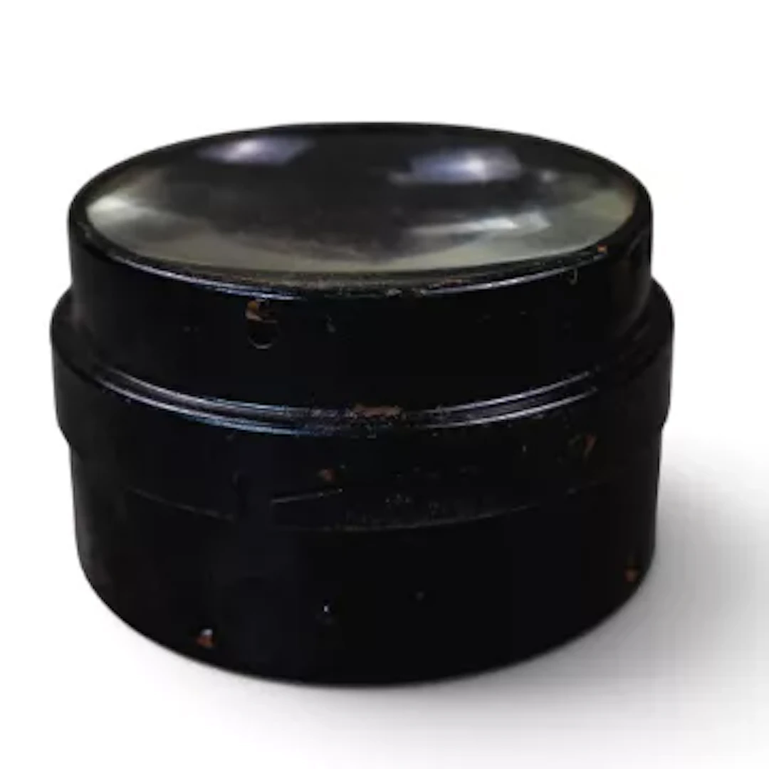 Large heavy-duty optical glass condenser lens enclosed in a black