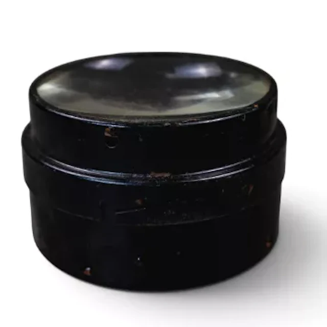 Large heavy-duty optical glass condenser lens enclosed in a black