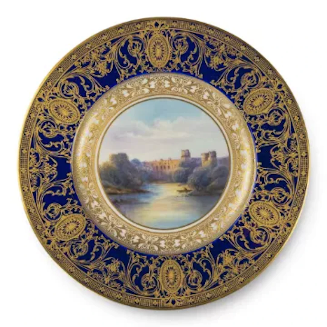 A Royal Worcester plate decorated with landscape scene of Warwick