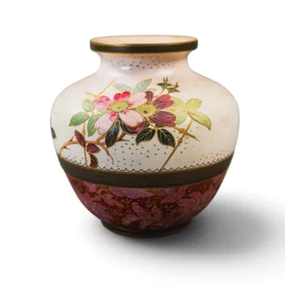 A Doulton Burslem vase, decorated with a floral design, with a lace/textured