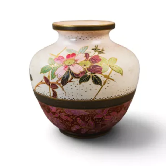 A Doulton Burslem vase, decorated with a floral design, with a lace/textured