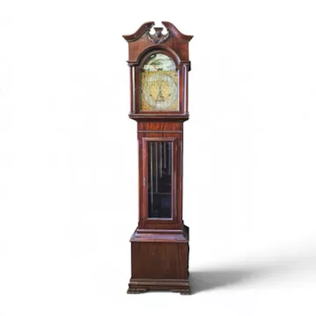 An Edwardian mahogany tubular-bell longcase clock featuring brass