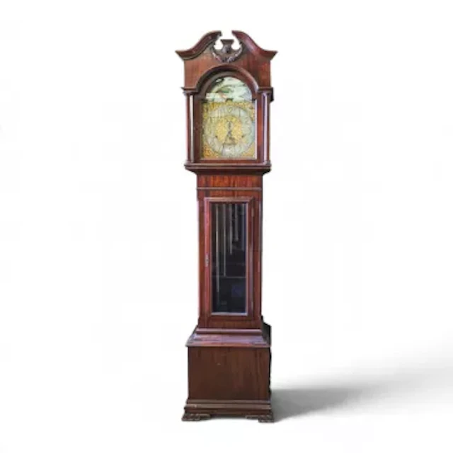 An Edwardian mahogany tubular-bell longcase clock featuring brass