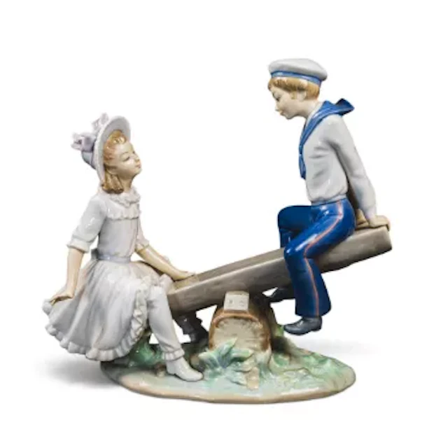 Lladro Porcelain figure 'Seesaw' model no.1255 depicting a young boy