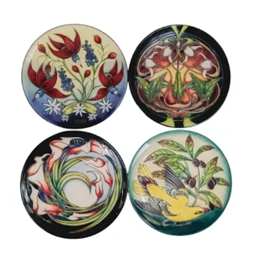 Four Moorcroft year plates dated 2001, 2003, 2004 & 2005, D.22.5cm each.