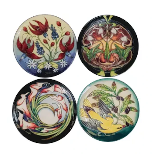 Four Moorcroft year plates dated 2001, 2003, 2004 & 2005, D.22.5cm each.