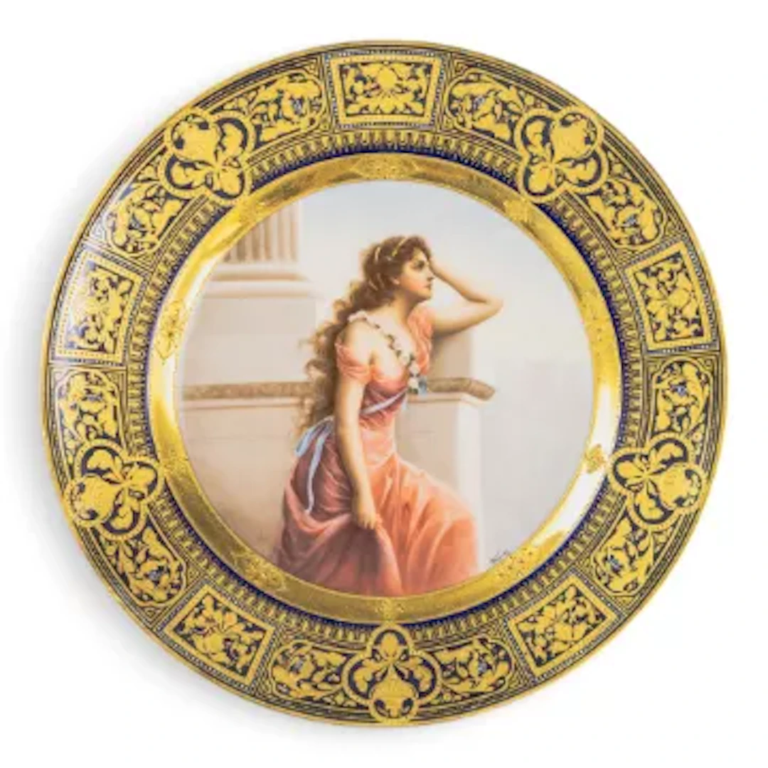 A Royal Vienna plate with a cobalt blue and gilt border, with centre
