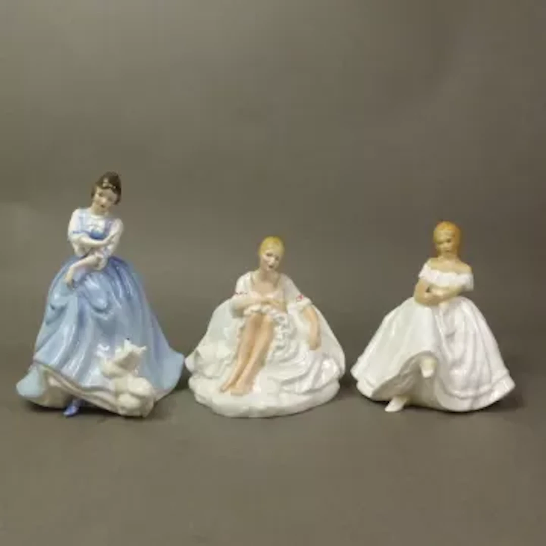 Three Royal Doulton figurines, Heather HN2956, Joanne HN2373 and Lorraine