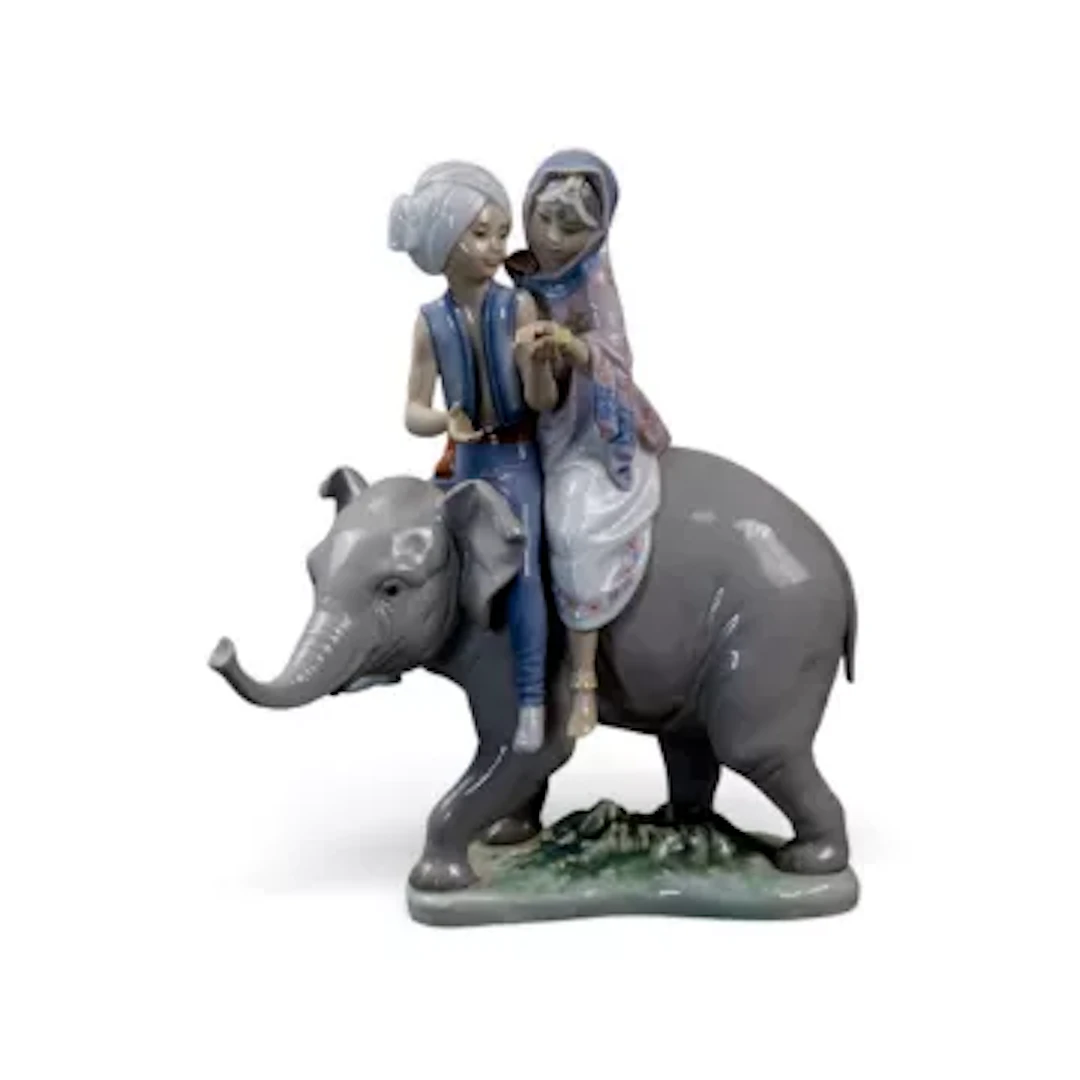 A Lladro figure 'Hindu Children' model no.5352 designed by Jose Puche