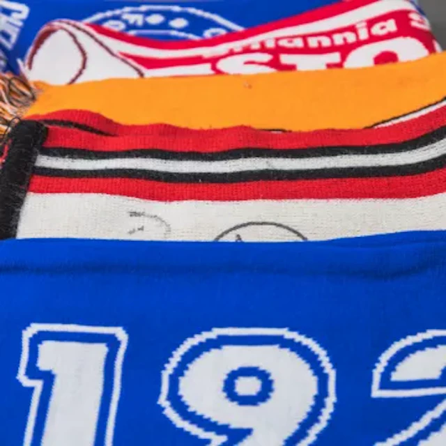 A good collection of football items featuring vintage club pennants