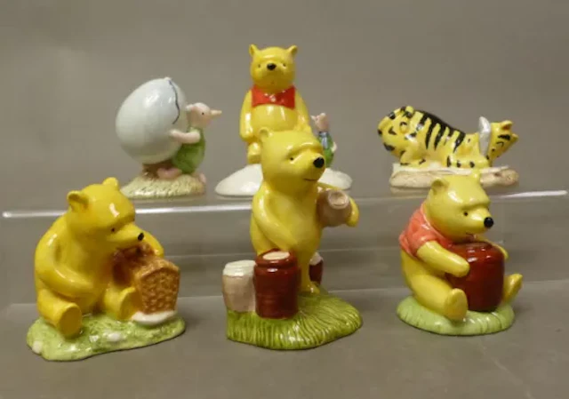 A collection of six Winnie the Pooh boxed figures, Pooh Counting the