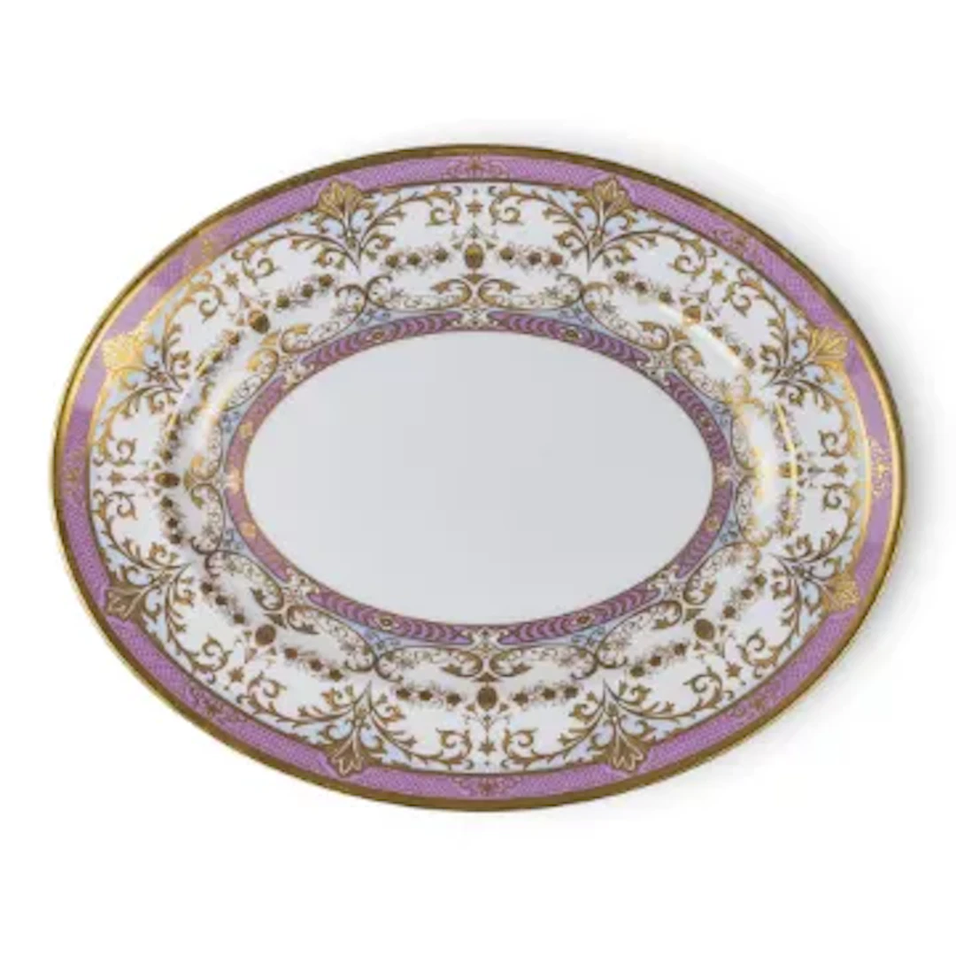 A large De Lamerie oval shaped dish decorated with a pink & gilt border