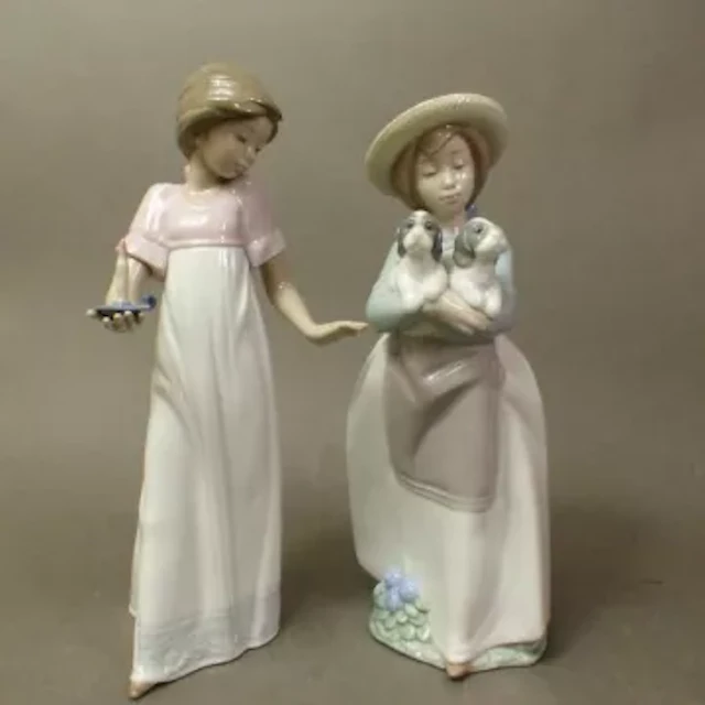 Two Nao figurines, models 1155 and 1156, tallest 25cm (2).