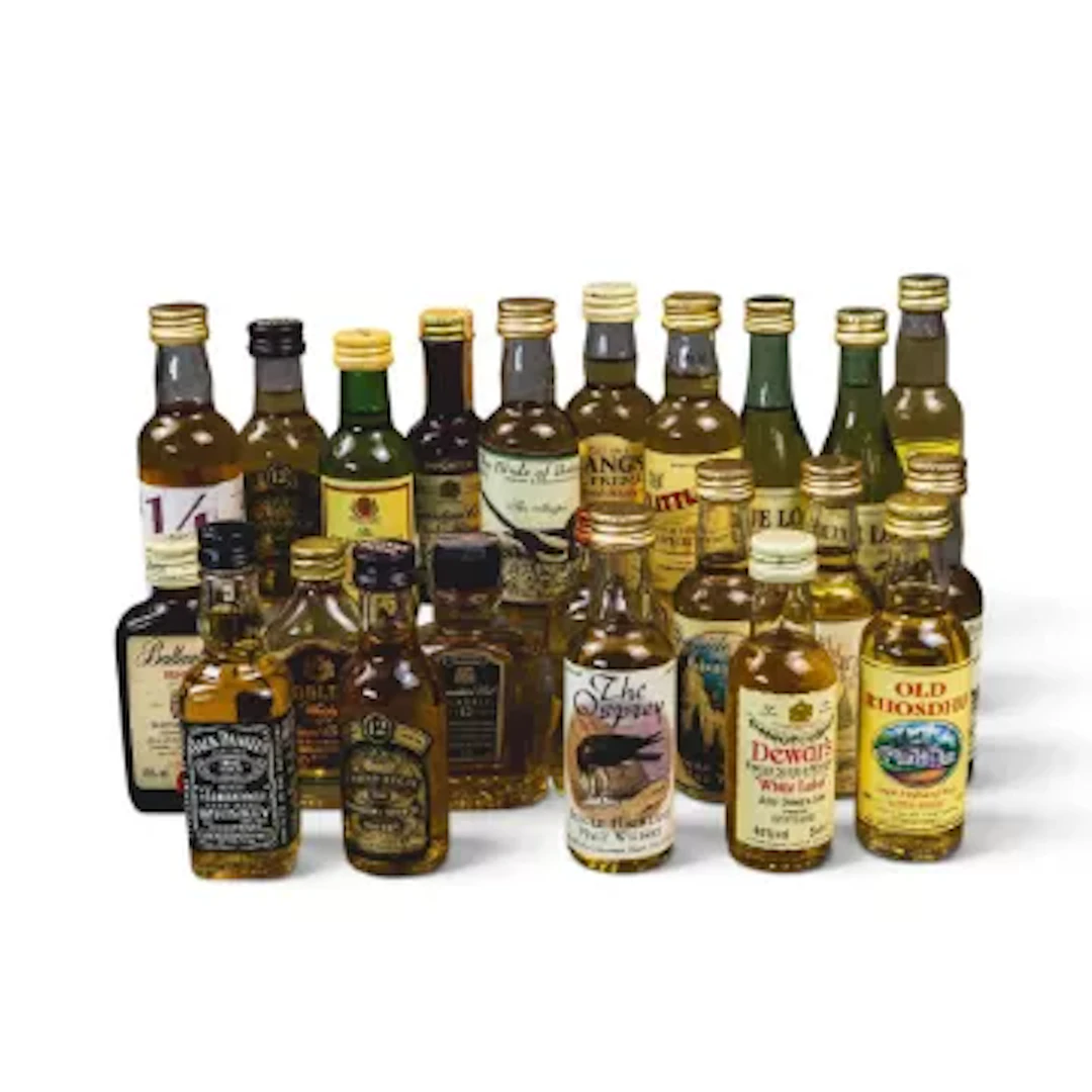 A good selection of whisky miniatures to include Ballantines, Isle
