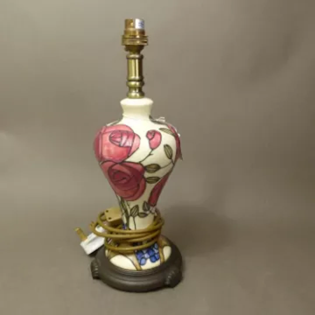 Old Tupton Ware tubelined floral table lamp, raised on a footed base