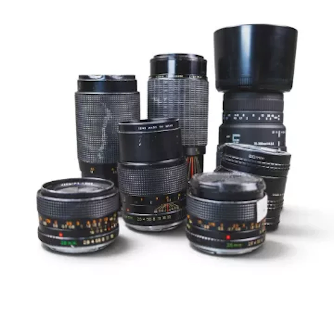 A collection of telephoto zoom lenses to include Sigma DG 70-300mm