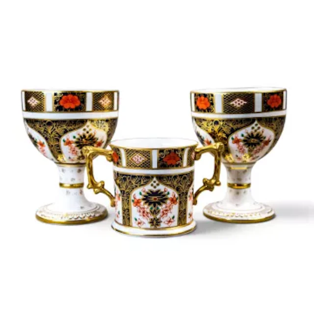 Royal Crown Derby, pair of goblets, together with a loving cup, in
