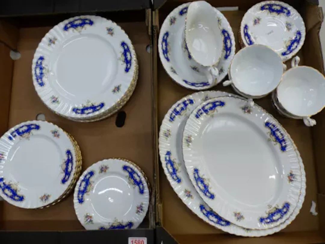 A traditionally decorated bone china dinner service, simply marked