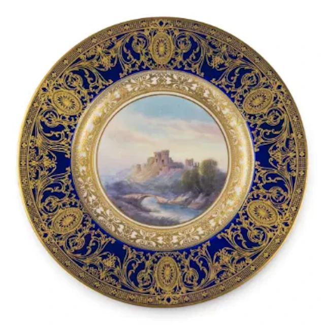 A Royal Worcester plate decorated with landscape scene of Saltwood