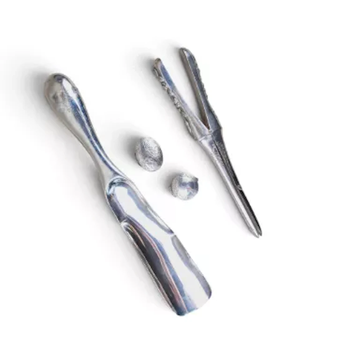 A collection of Silver items including shoehorn, silver glove stretcher