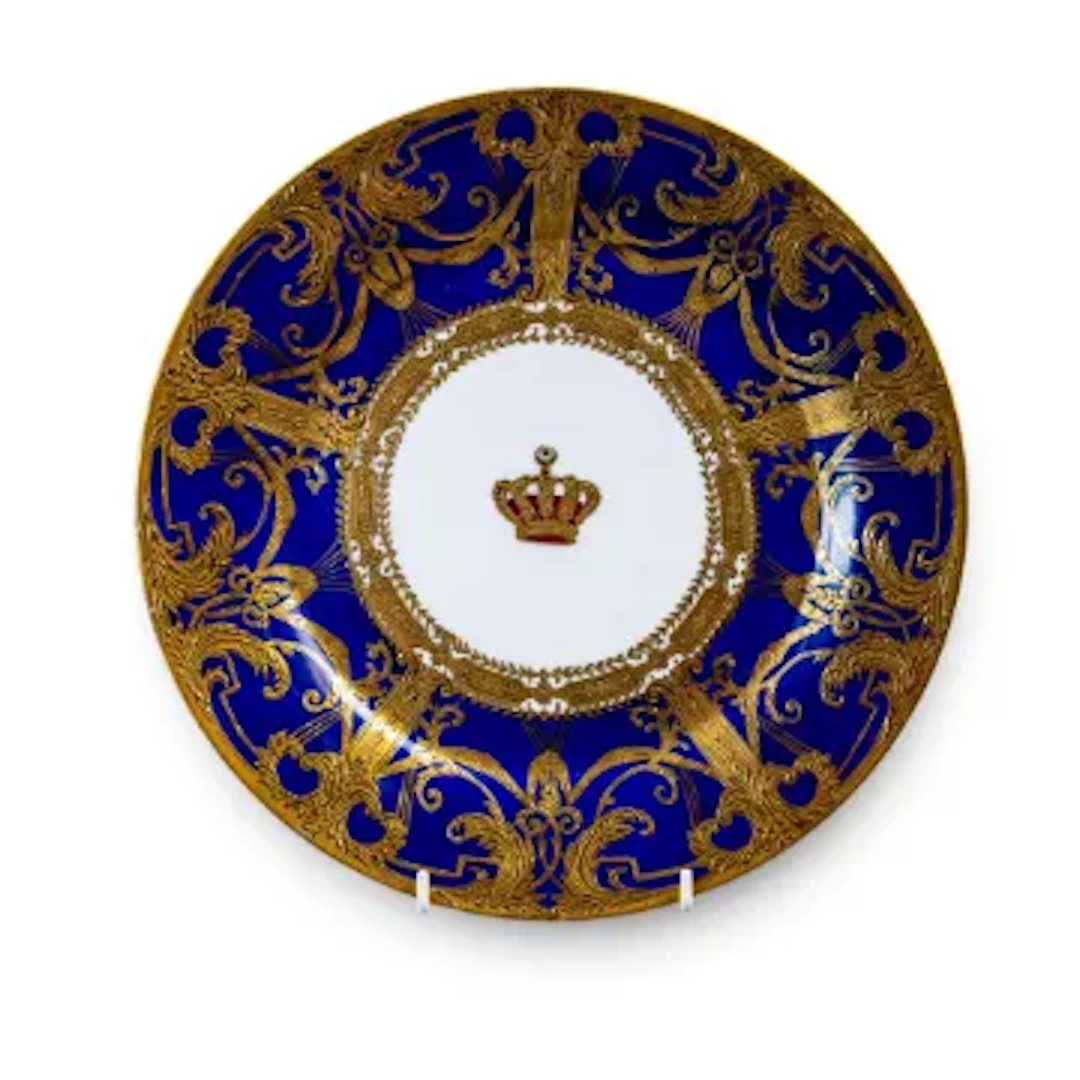 An early 20th century Sevres plate, ornately decorated with a gilded